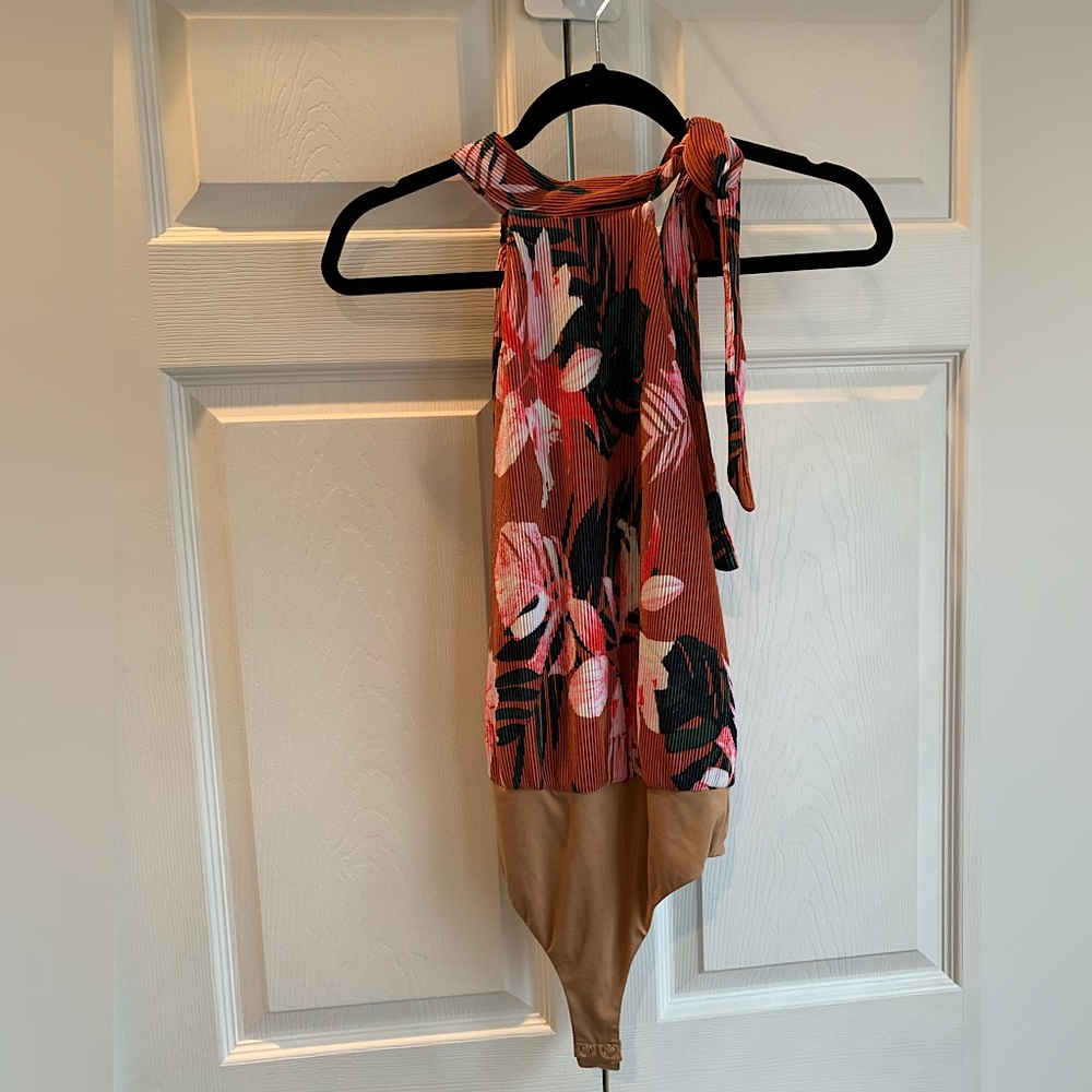 Camila Coelho, orange pink brown body suit, tropical flowers